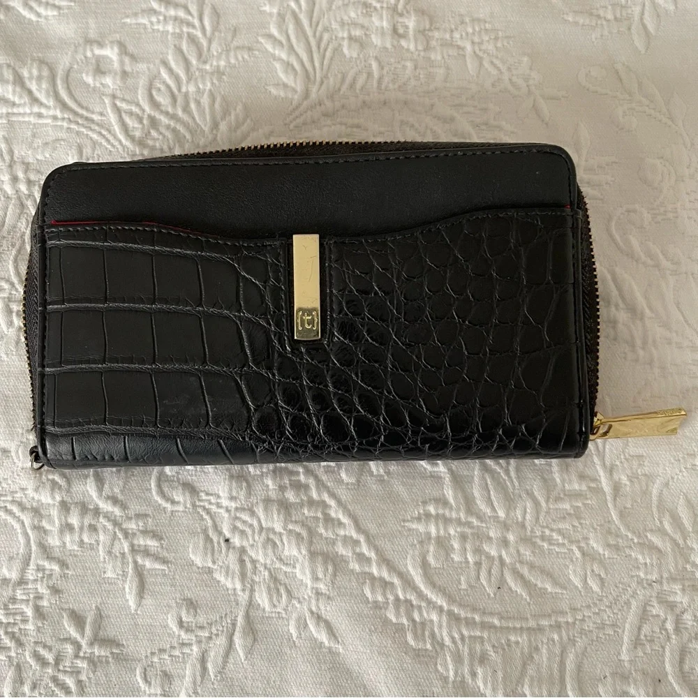 NWOT Tutilo Black wallet with wristlet. Gold hardware. Very nice